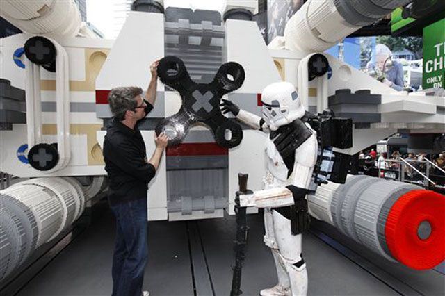 LEGO Master Builder Erik Varszegi and members of the 501st inspect the thrusters of the largest LEGO model ever built